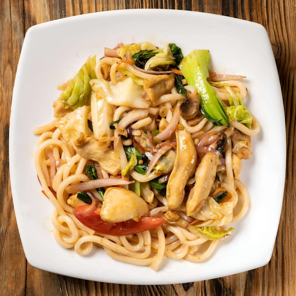 Sen Noodle House's stir-fried udon noodles with chicken, bok choy, mushrooms, and other vegetables.